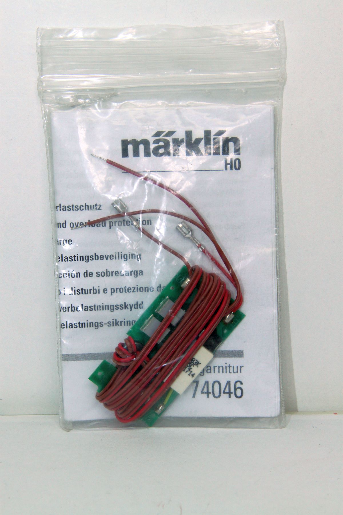 Märklin 74046, Connection set with radio interference suppression, AC, for H0 gauge, with original packaging.
